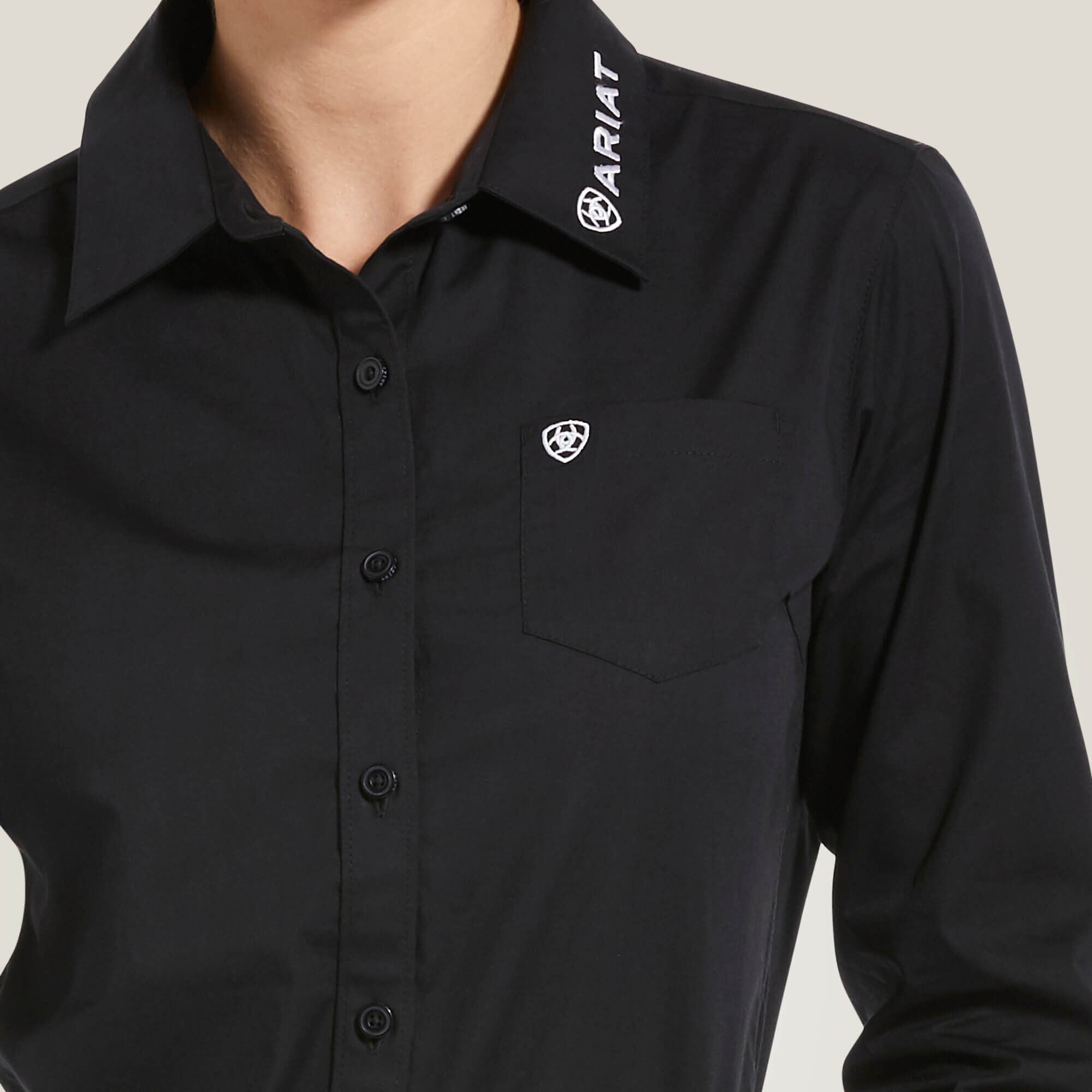 Close-up of Ariat Team Kirby Stretch Shirt collar and chest detail in black