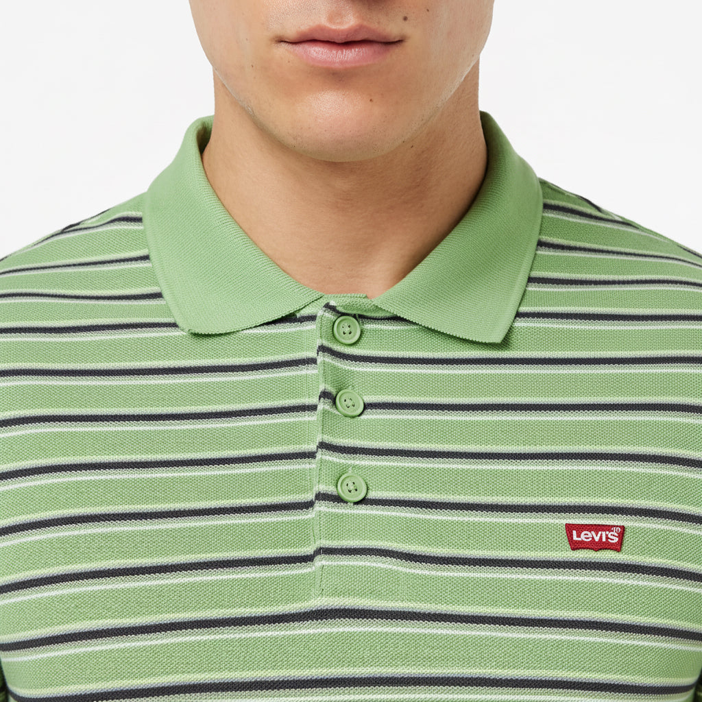 Close-up of Levi’s Housemark Polo collar and chest logo in green stripe