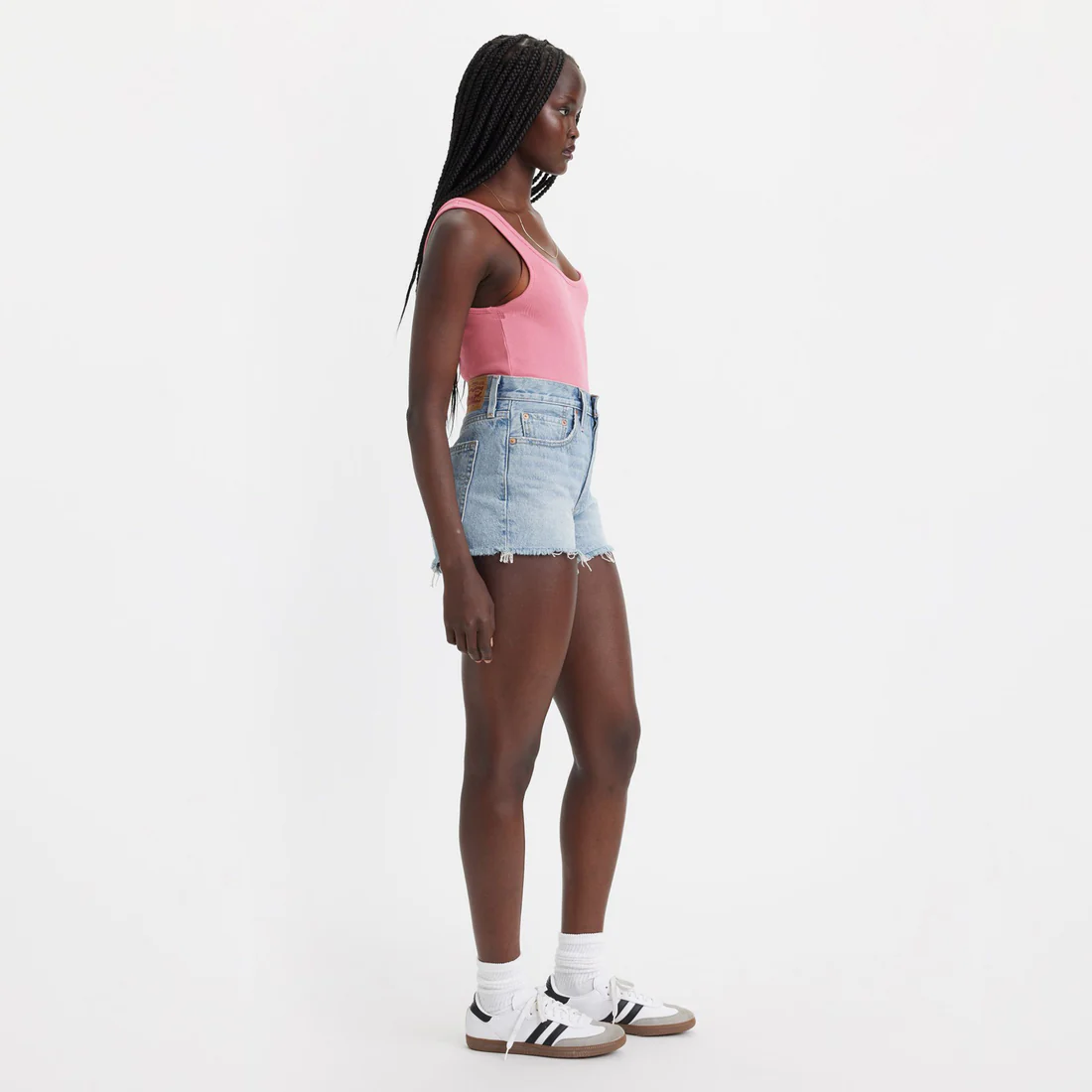 Side view of Levi’s 501 High Rise Frayed Hem Cut Off Shorts on model