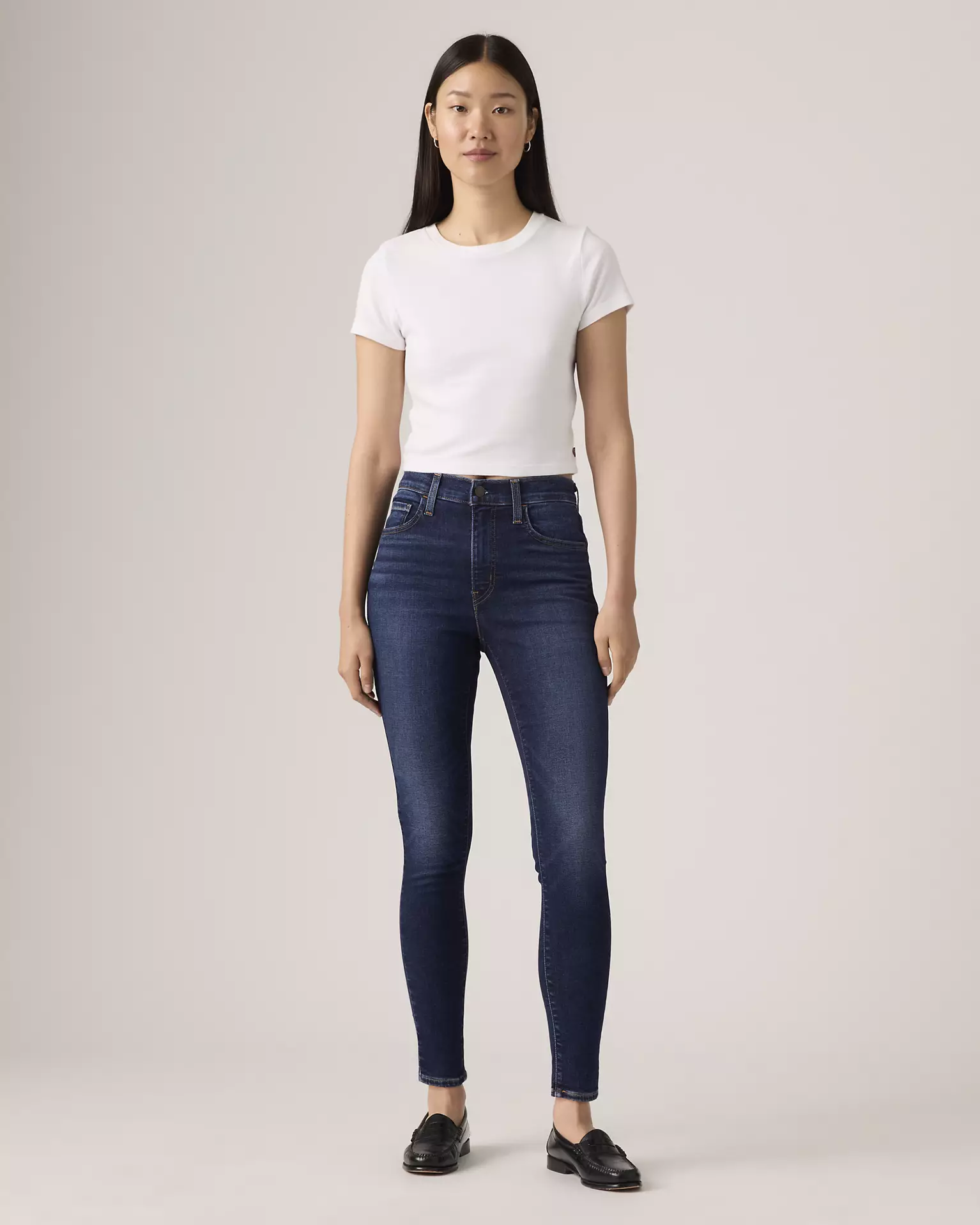 Levi’s 720 High Rise Super Skinny Women’s Jeans front view on model in dark blue denim