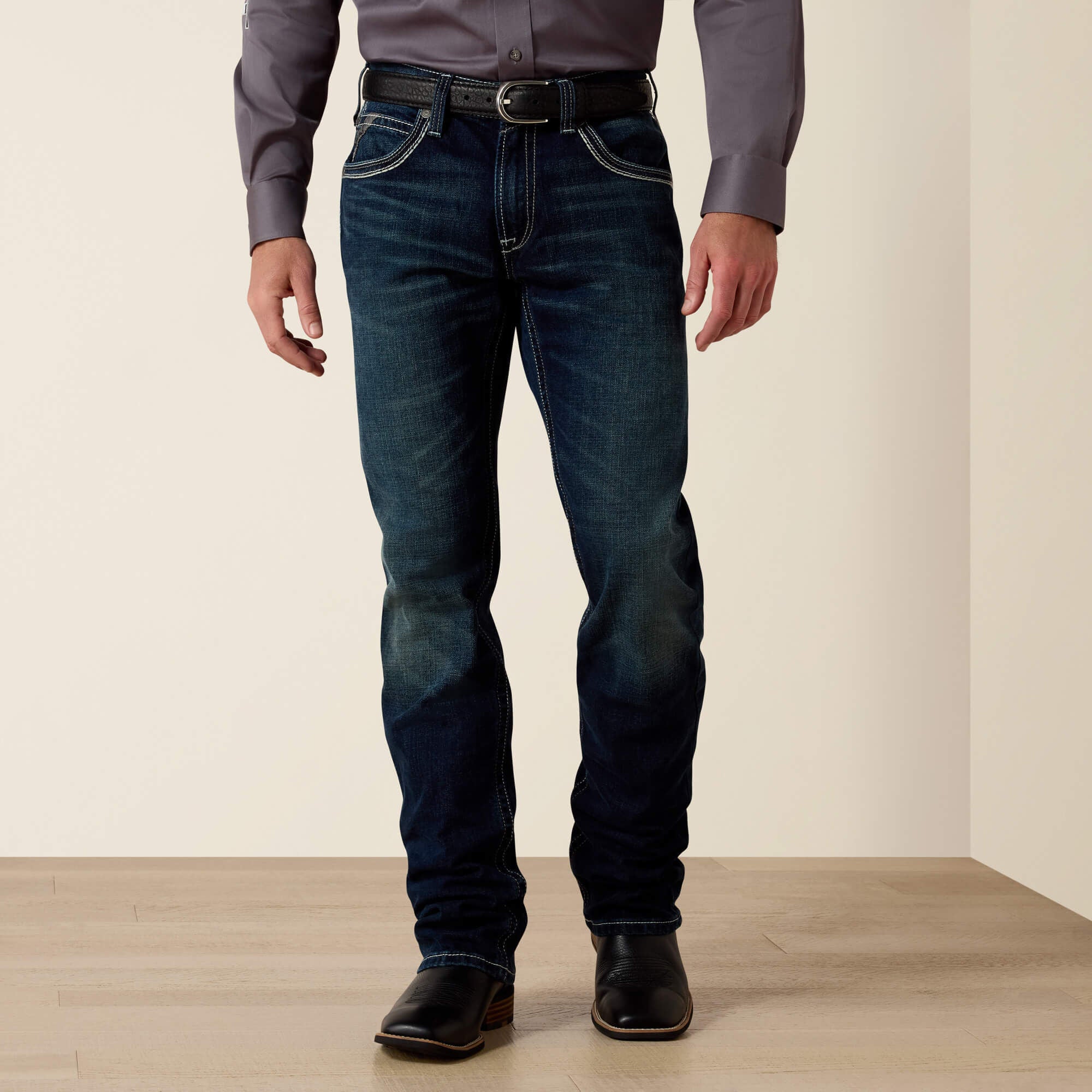 Ariat M5 Slim Stretch Coltrane Stackable Straight Leg Jean front view on model in blue denim
