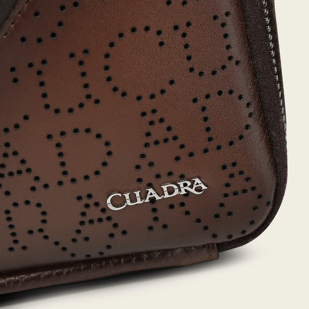 Close-up of Cuadra monogram and leather texture on Brown Caiman Zipper Bag