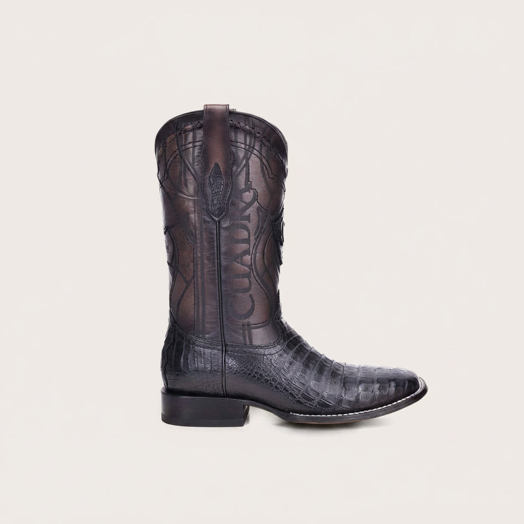 Angled side view of Cuadra Engraved Cayman Western Boot in dark leather