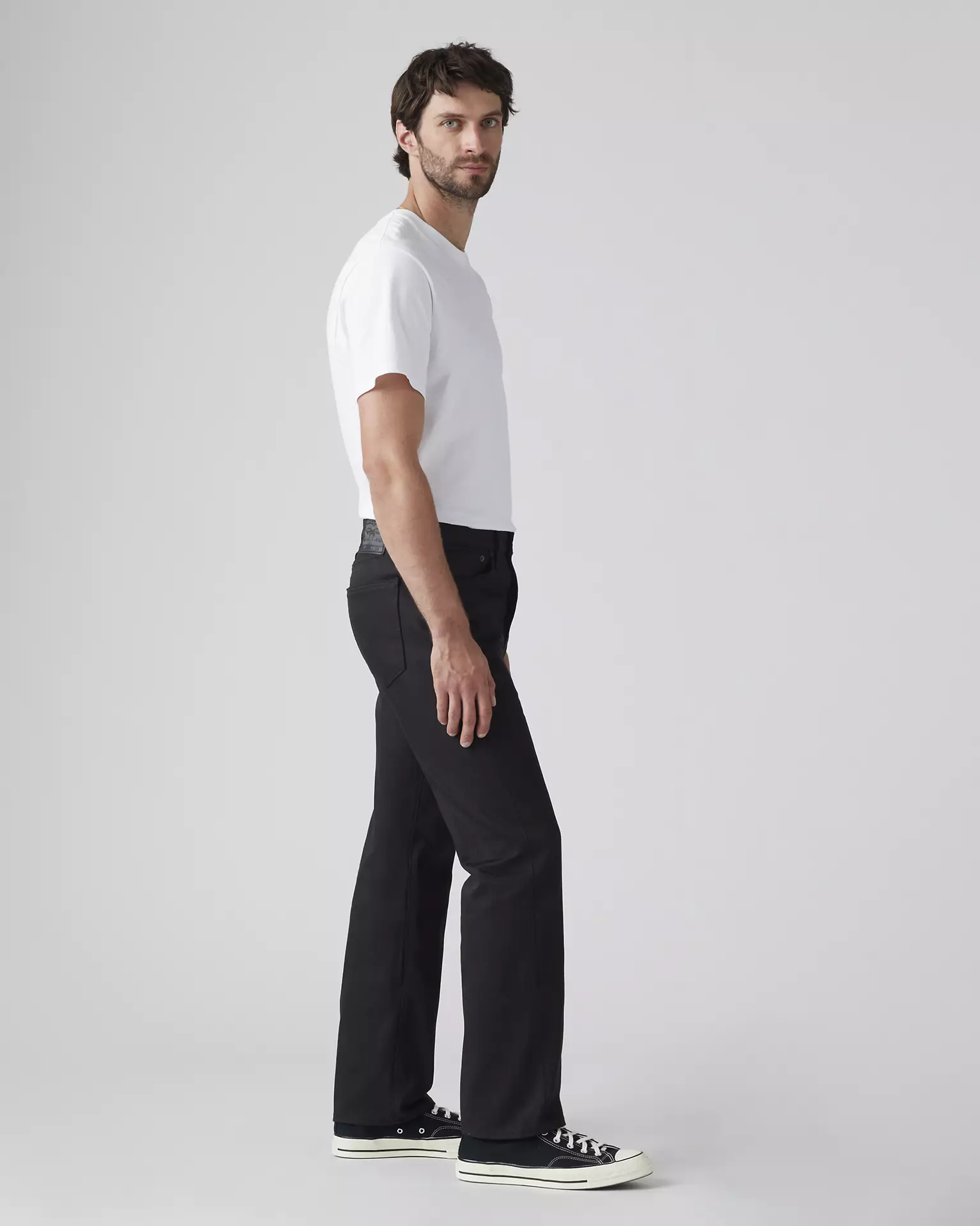 Levi’s 501 Original Shrink-to-Fit Men’s Jeans side view on model in black denim