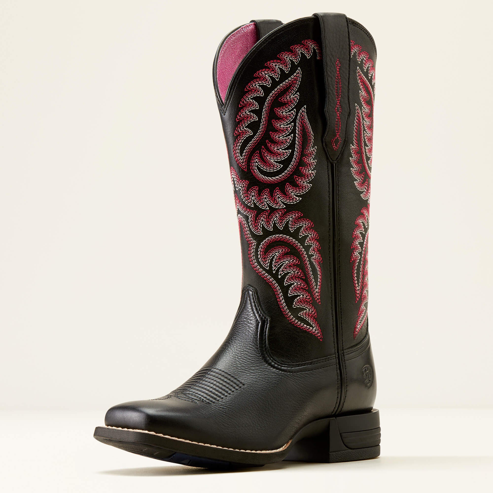 Ariat Cattle Caite Stretchfit Western Boot side view in black leather with pink stitched shaft