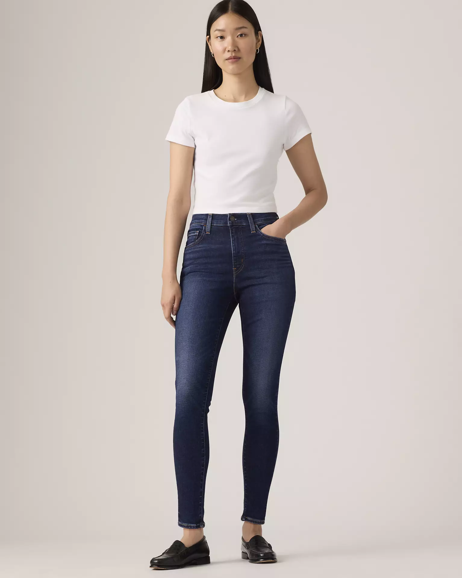 Levi’s 720 High Rise Super Skinny Women’s Jeans front view on model in dark blue denim