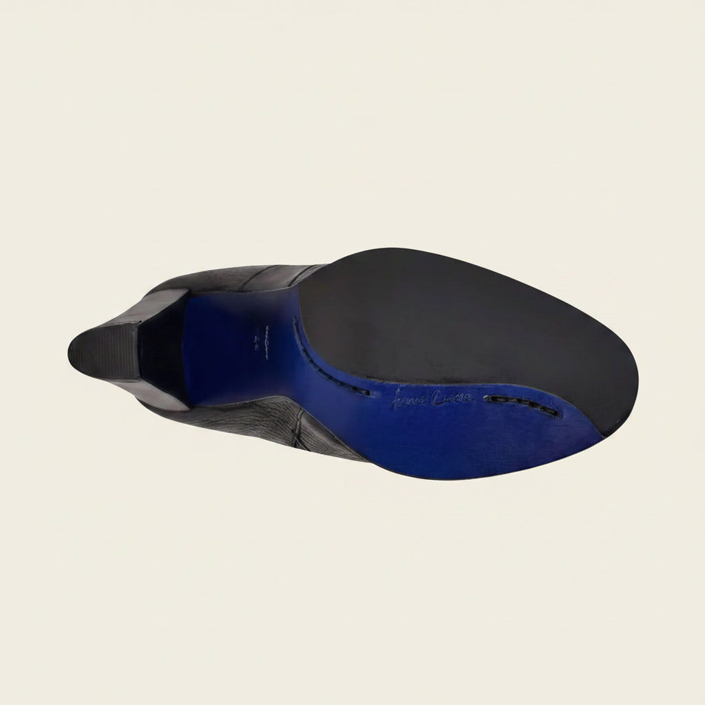 Outsole view of Cuadra Black Deer Ankle Bootie showing tread detail