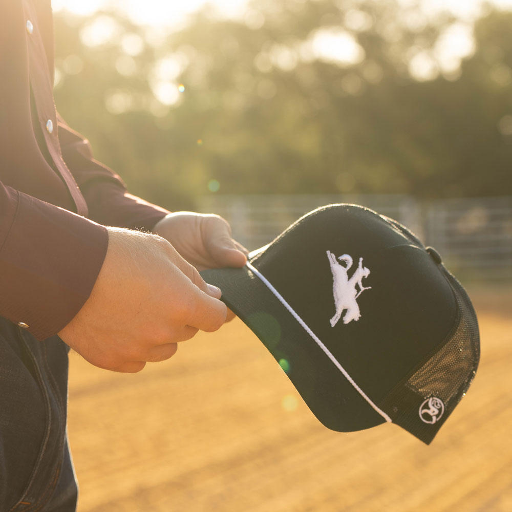 Hooey Whit Black White Logo Hat shown outdoors in use