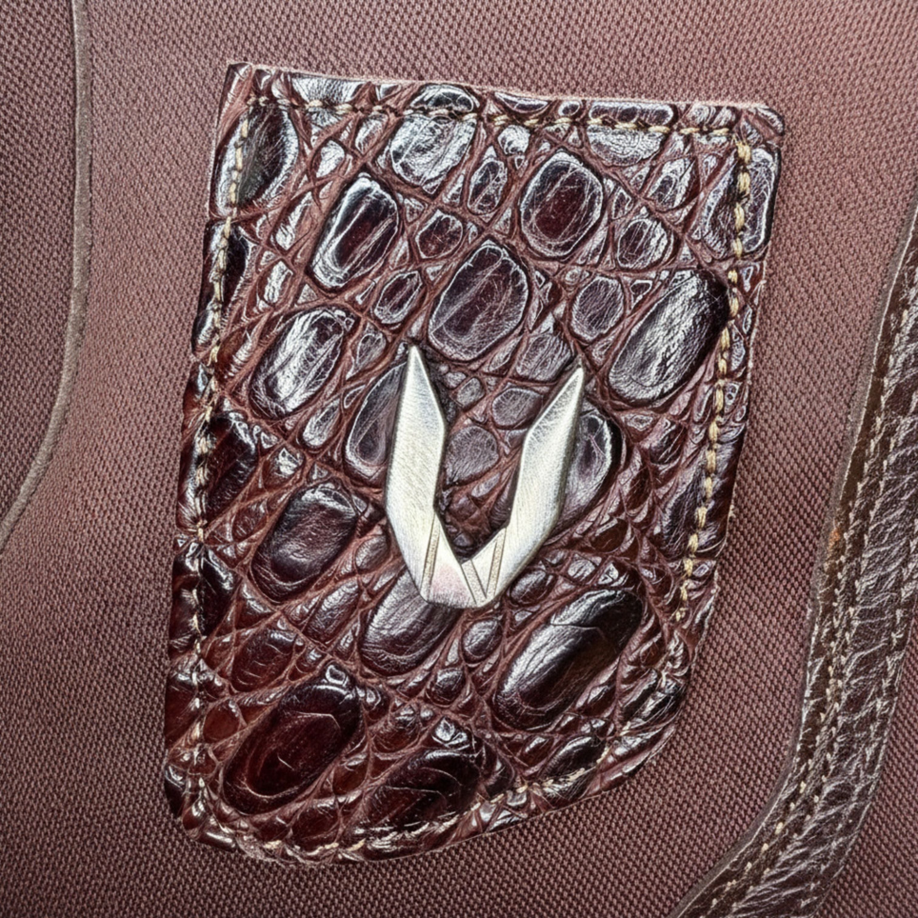 Close-up of café caiman belly leather texture on Vestigium boot